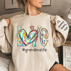Grandma makes christmas special unisex sweatshirt personalized family names sleeve print cozy fit