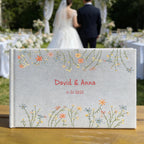unique hand embroidered flowers linen wedding guest book landscape close up