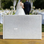 unique wedding guest book newly engaged couple holding hands close up